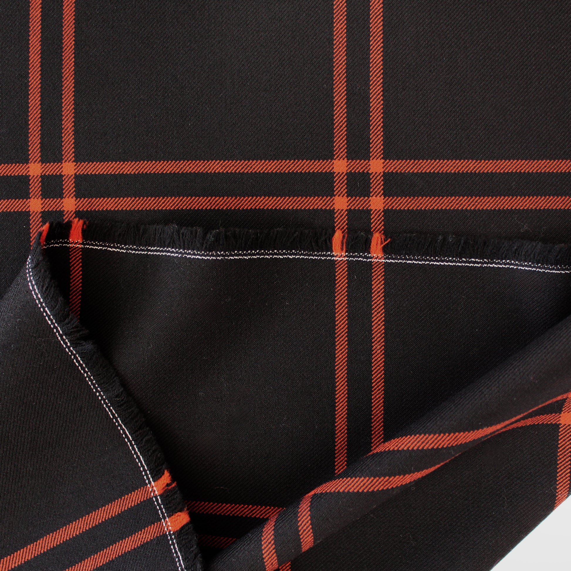 Italian windowpane plaid wool twill suiting - persimmon/black