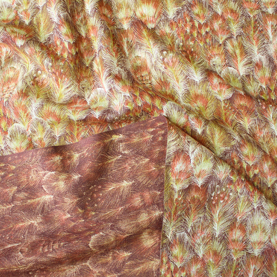 textured fabric with feather pattern in brown, green, and white.