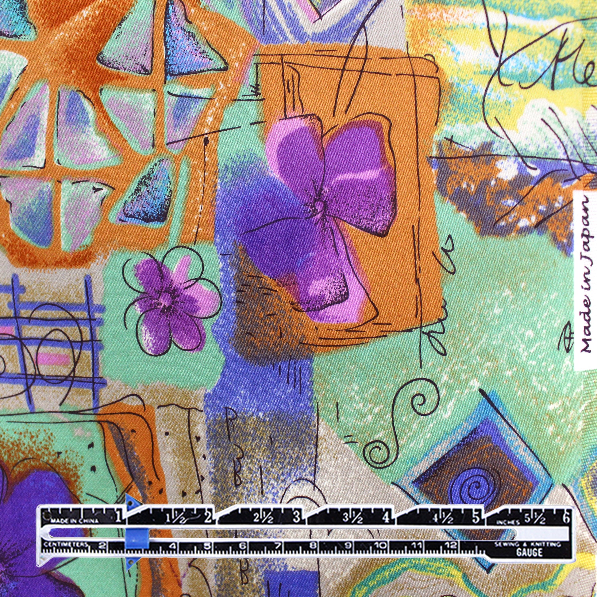 Japanese 'patchwork story' printed stretch denim