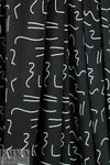 squiggles on black bamboo/spandex jersey - Oeko-Tex cert. 1.875 yd
