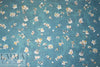 Caroline C0nstas blossoms on teal silk chiffon