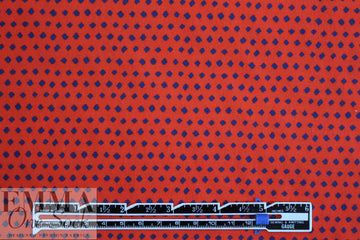 famous designer navy diamonds on red cotton woven