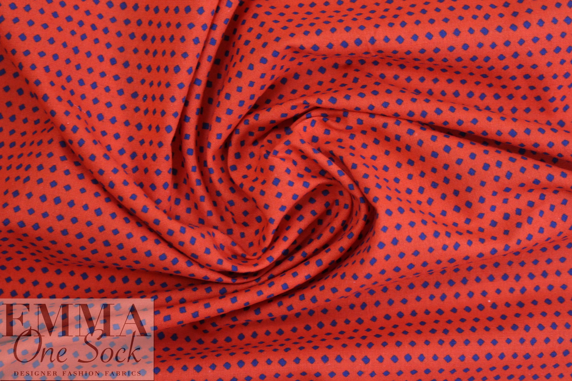 famous designer navy diamonds on red cotton woven
