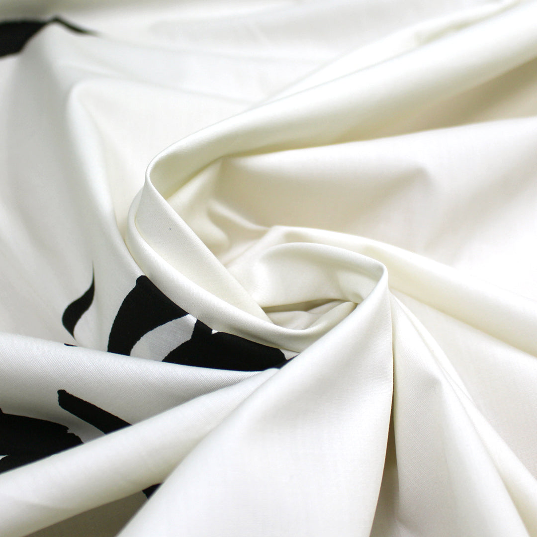 Italian 'making faces' cotton shirting panel .75 yds - 1 Panel