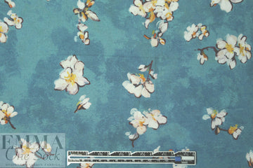 Caroline C0nstas blossoms on teal cotton stretch shirting