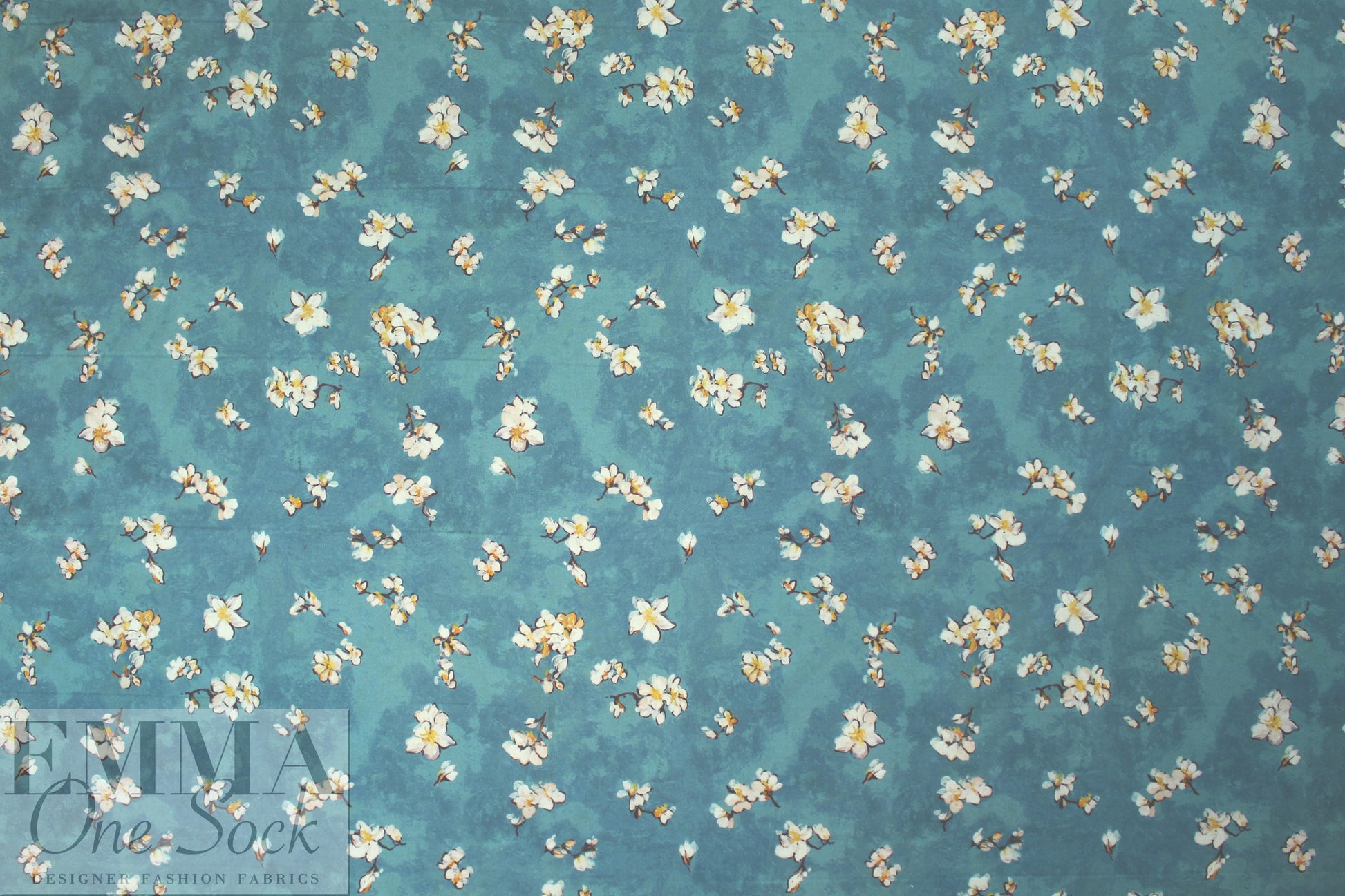 Caroline C0nstas blossoms on teal cotton stretch shirting
