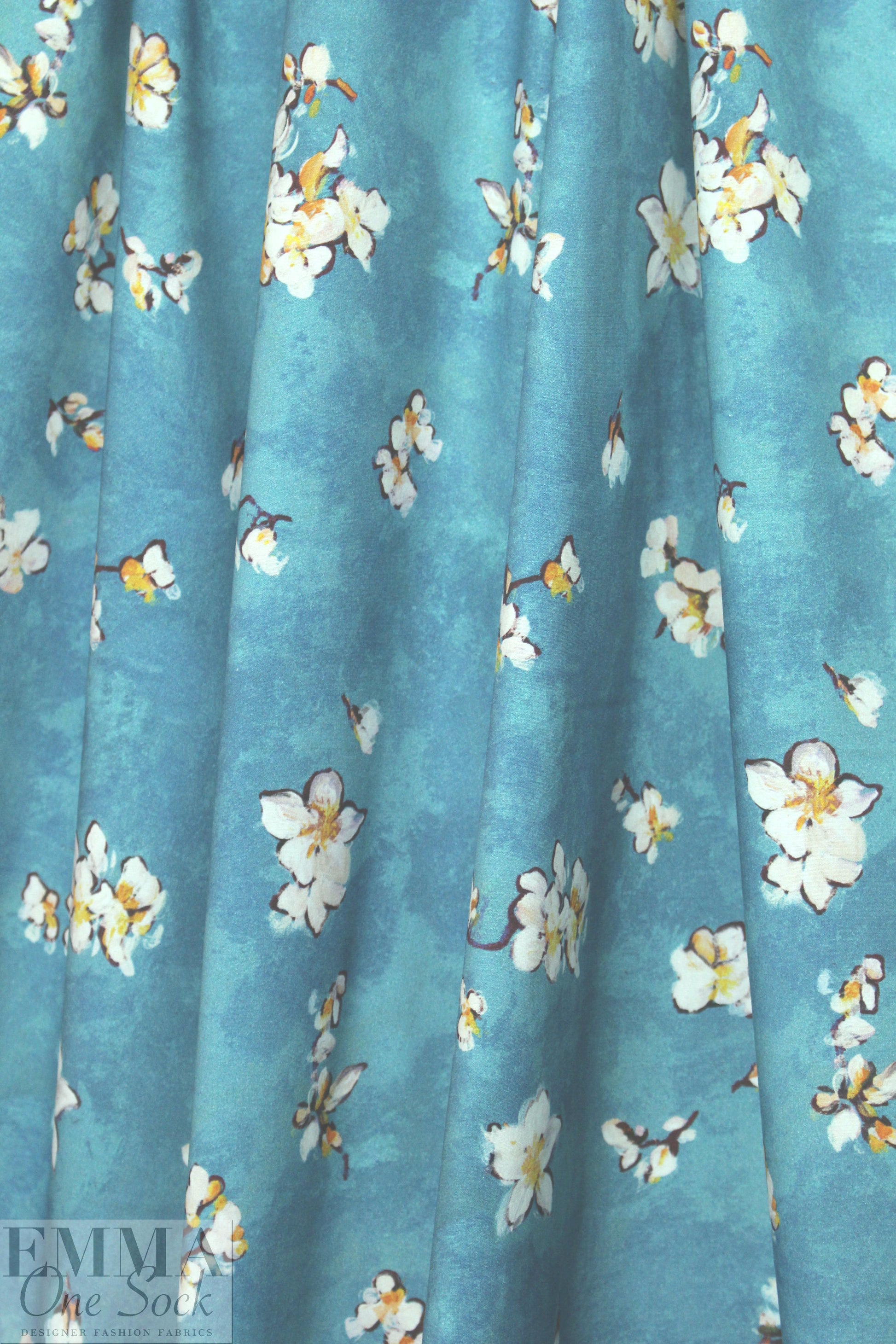 Caroline C0nstas blossoms on teal cotton stretch shirting