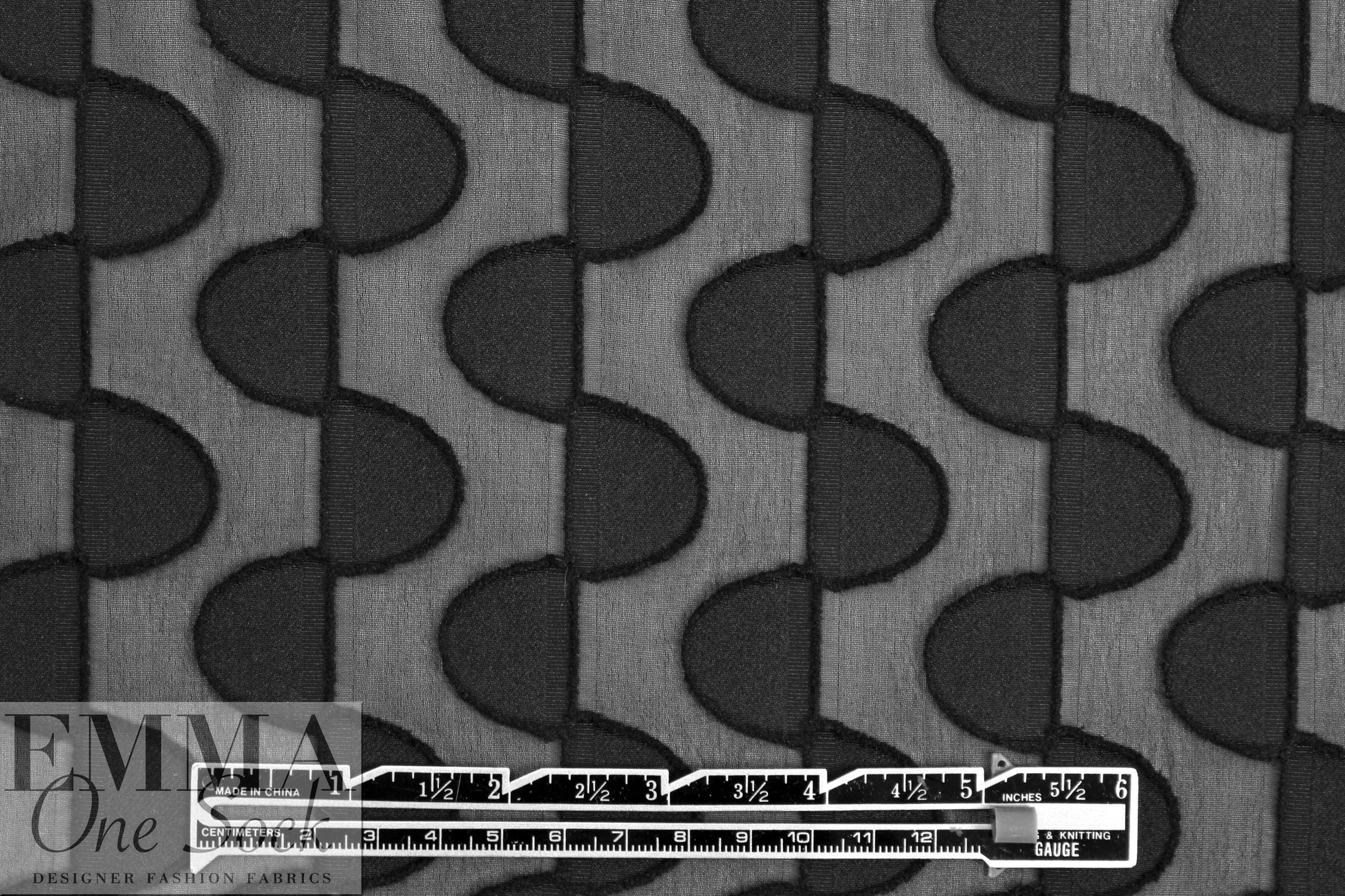NY designer black clipped half moon 3-D woven 1.375 yd