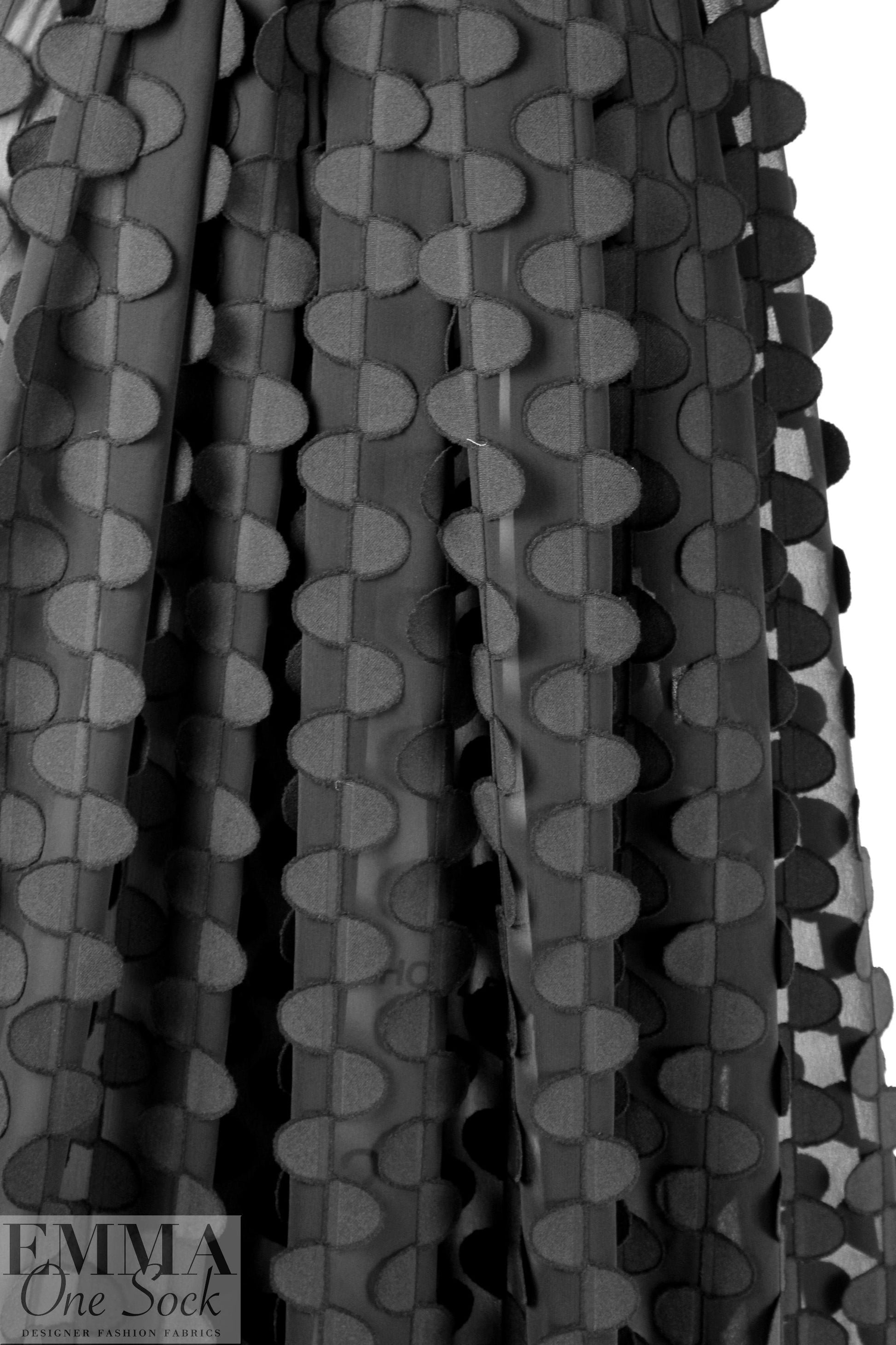 NY designer black clipped half moon 3-D woven 1.375 yd