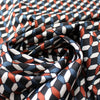 yarn dyed 'diamond link' jacquard knit - black/orange/teal 1.75 yd