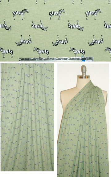 zebras on sagey green rayon/lycra knit 1.125 yds