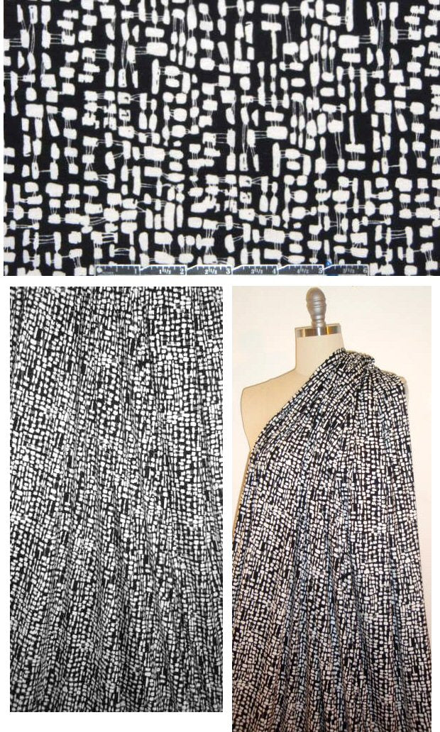 white graphic on black print rayon/lycra knit 1.875 yds