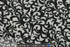 gray heather/black fleur-de-lis rayon/spandex knit 1.125 yds
