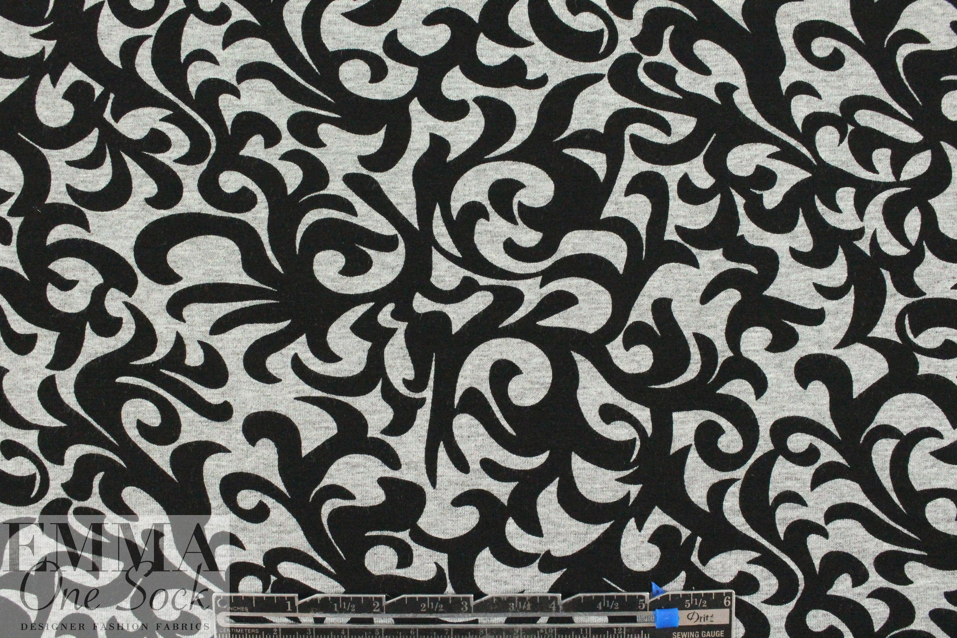 gray heather/black fleur-de-lis rayon/spandex knit .75 yds