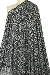 gray heather/black fleur-de-lis rayon/spandex knit 1.875 yd