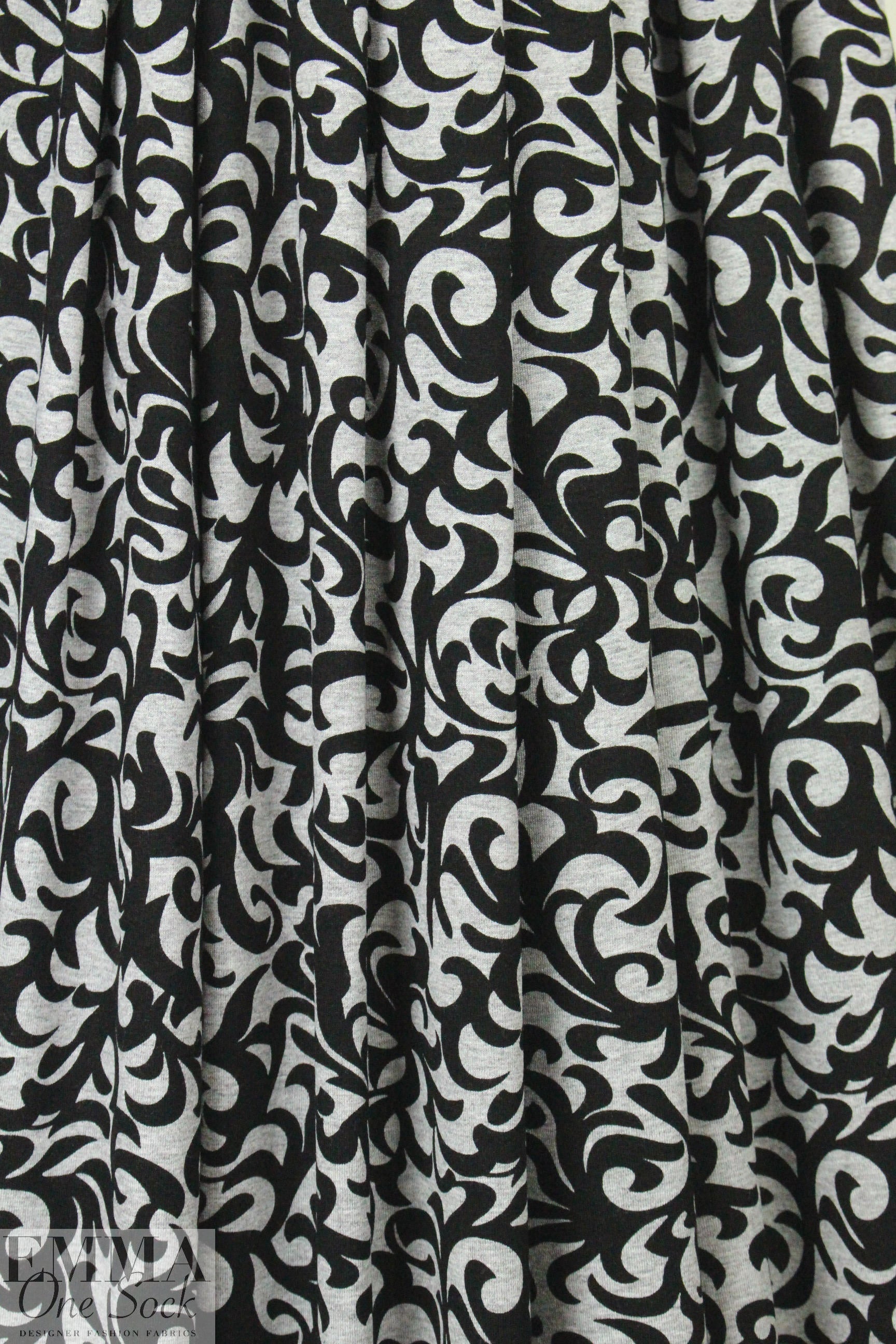 gray heather/black fleur-de-lis rayon/spandex knit .75 yds
