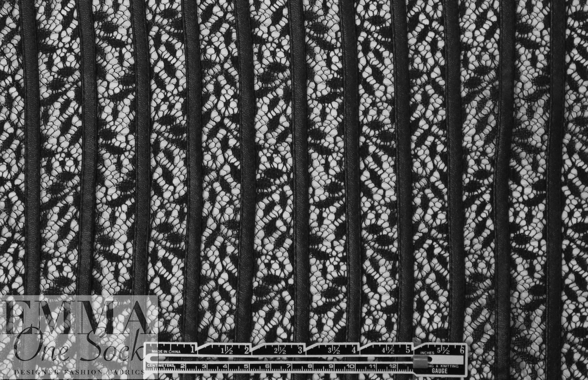 NY designer black faux leather strips on lace