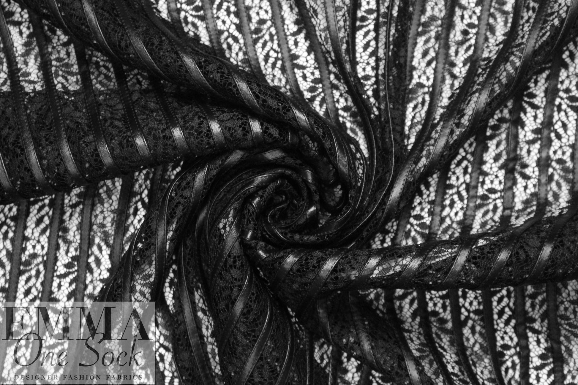 NY designer black faux leather strips on lace