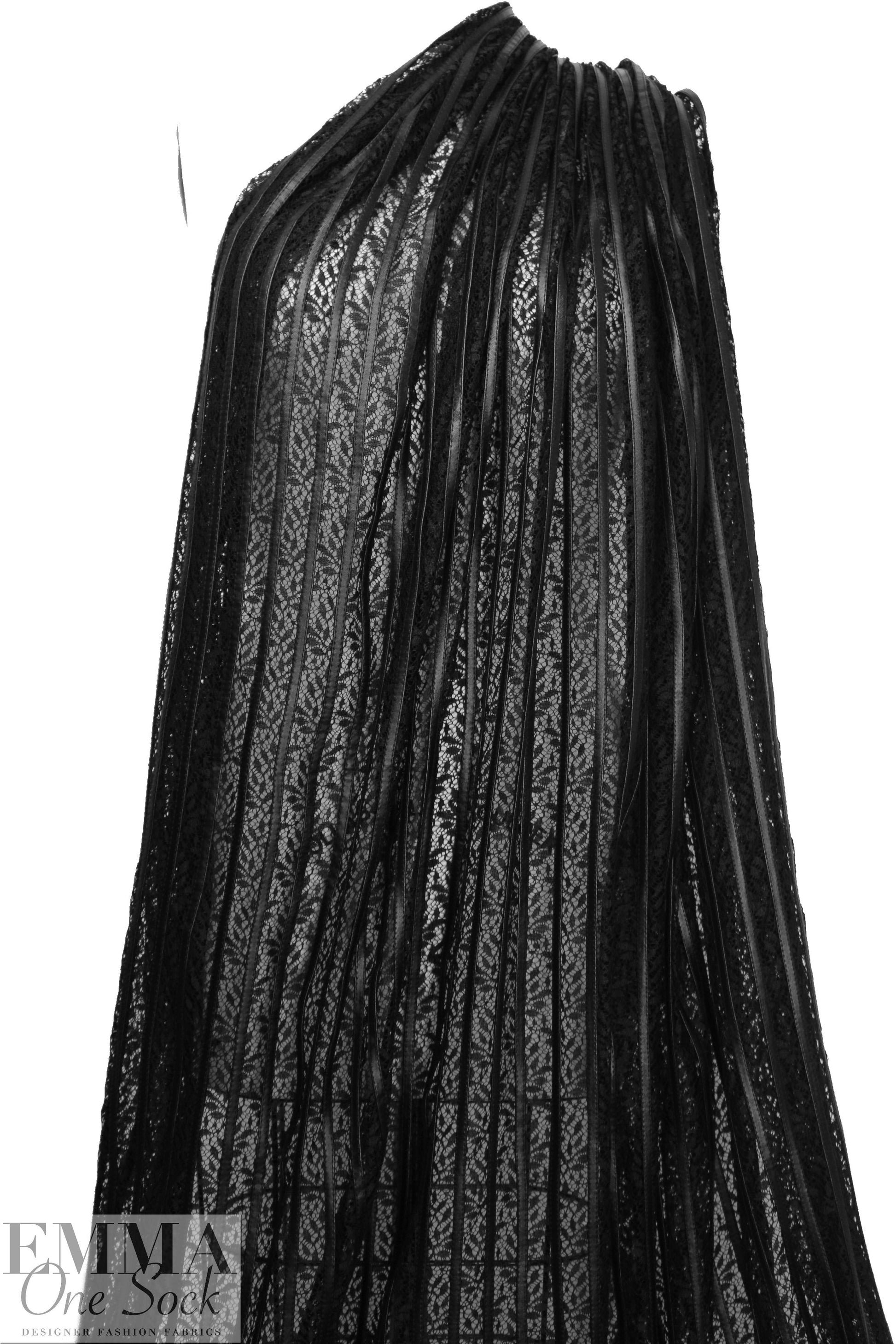 NY designer black faux leather strips on lace