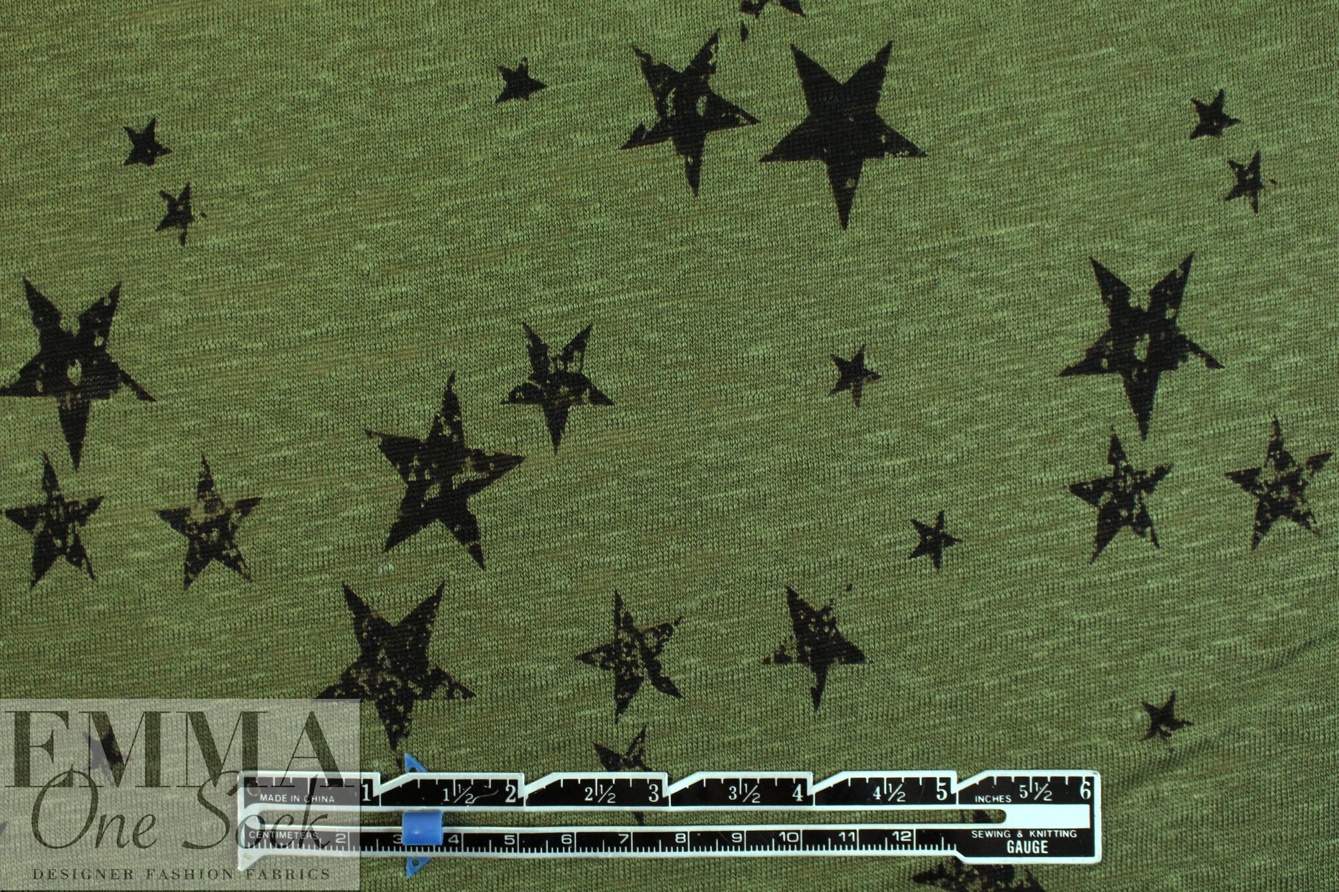 NY designer loden/black star print linen knit .5 yds