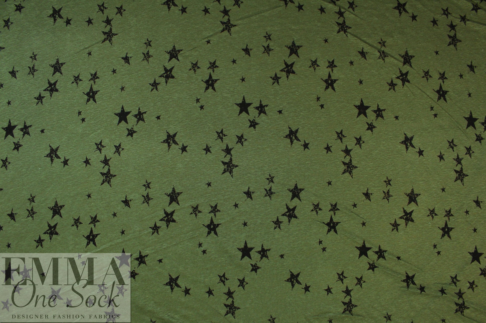 NY designer loden/black star print linen knit .5 yds