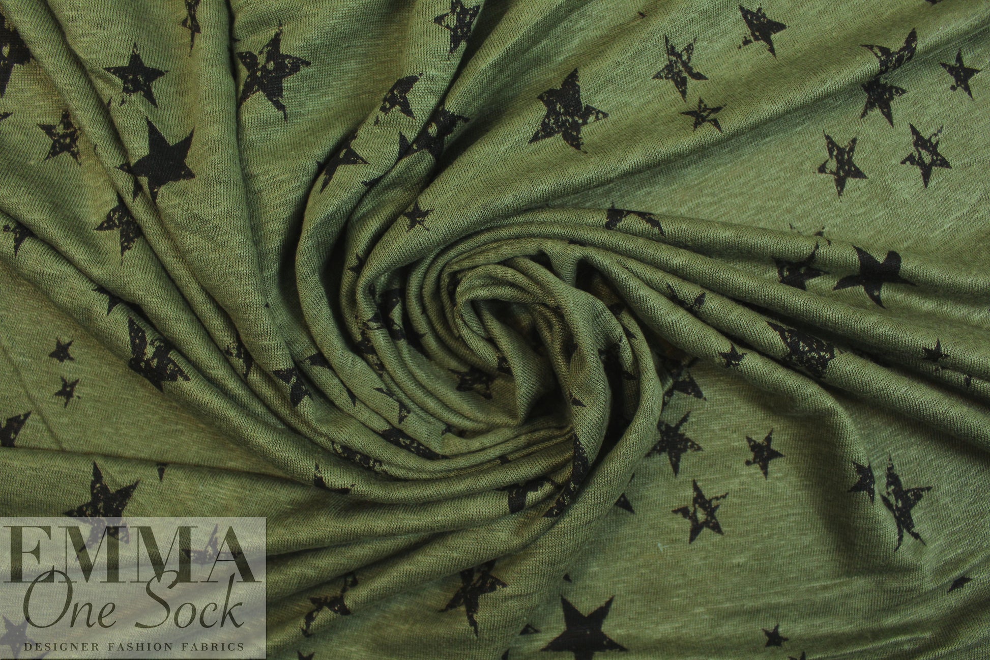 NY designer loden/black star print linen knit .5 yds