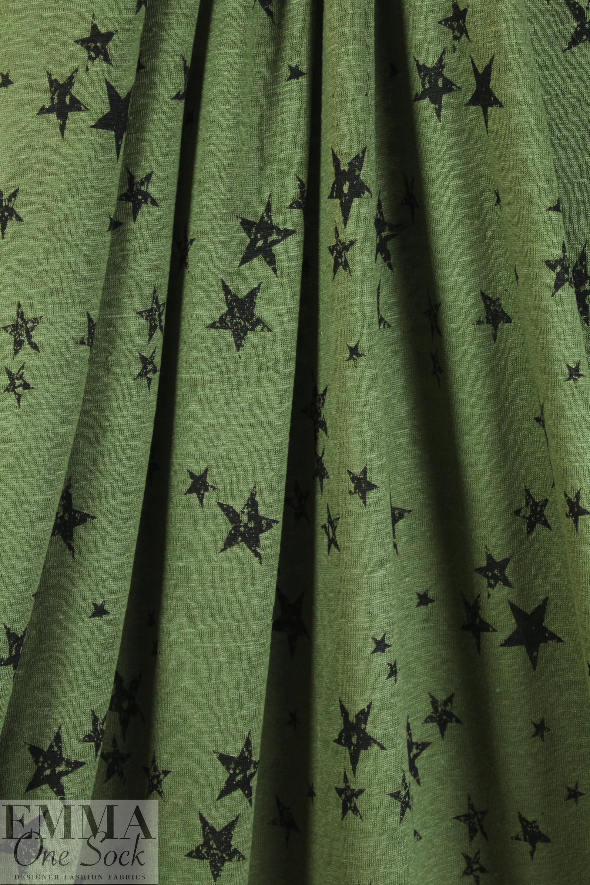 NY designer loden/black star print linen knit .5 yds
