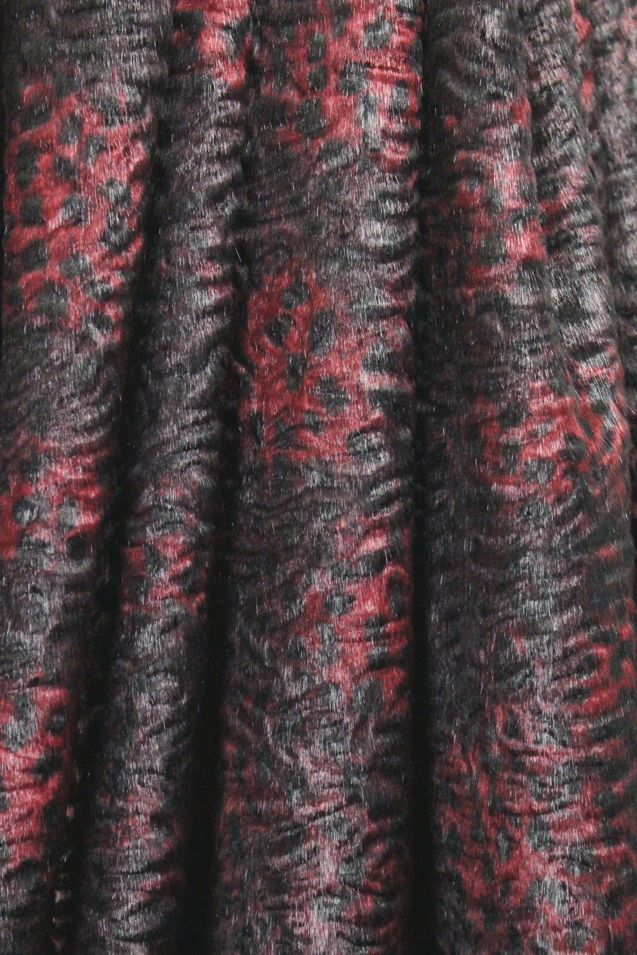 Tah@ri printed faux Persian lamb - burgundy animal 1.375 yds