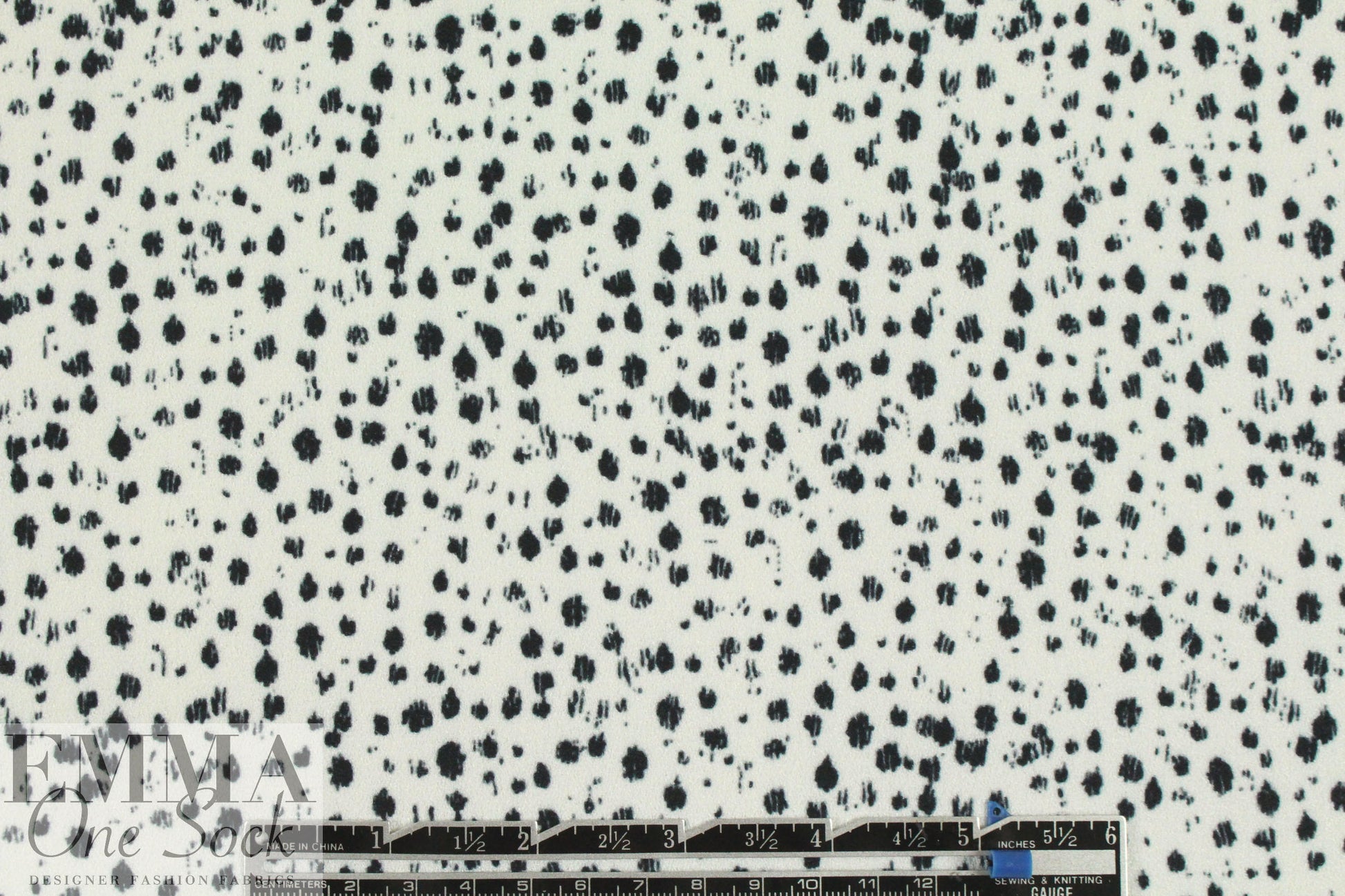 Rebecca Tayl0r speckles on white stretch crepe woven .875 yds