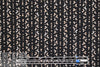 NY designer petal stripes on black polysilk  .5 yds