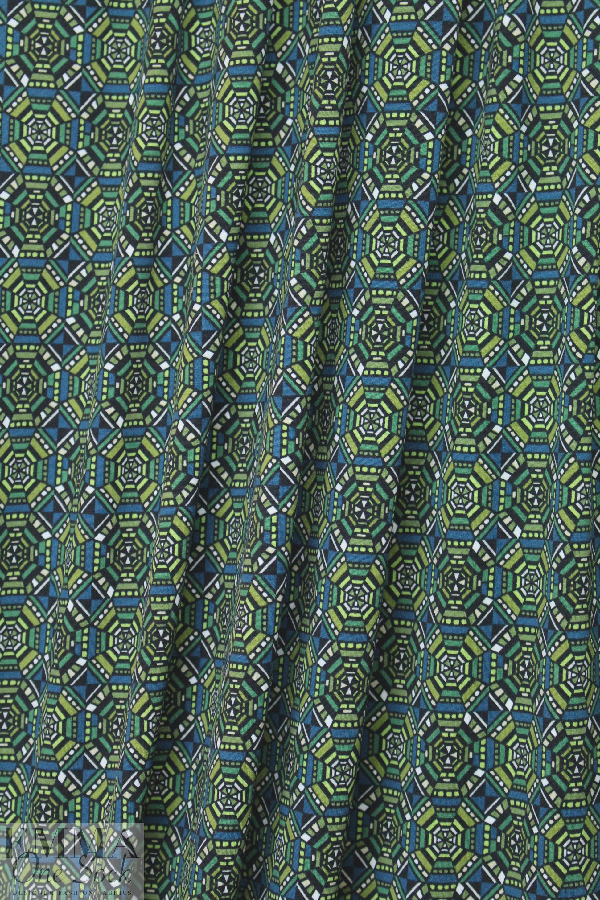 NY designer olive/teal graphic ITY knit .75 yds