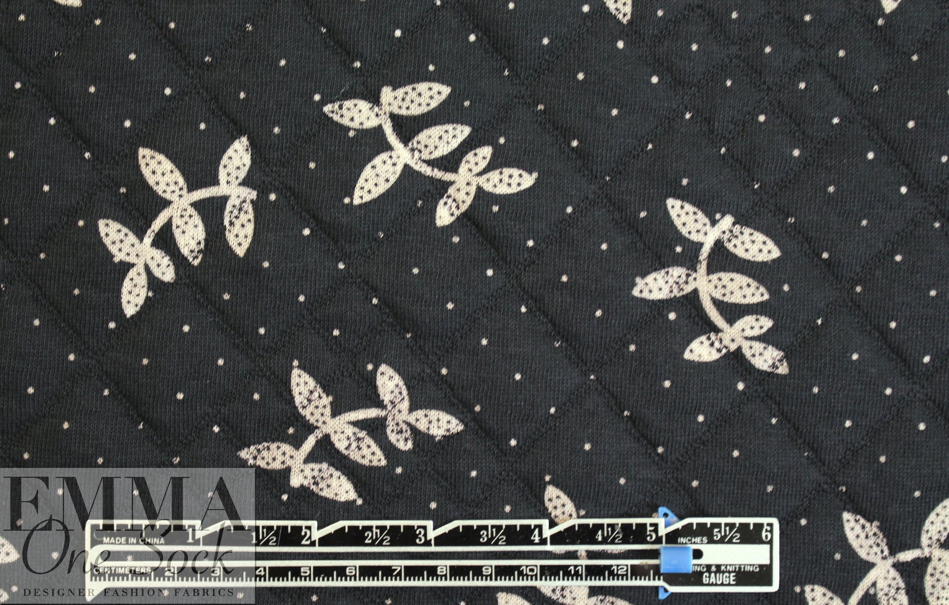 French printed 3-ply quilted-look knit - black leaf/dot 1.875 yds