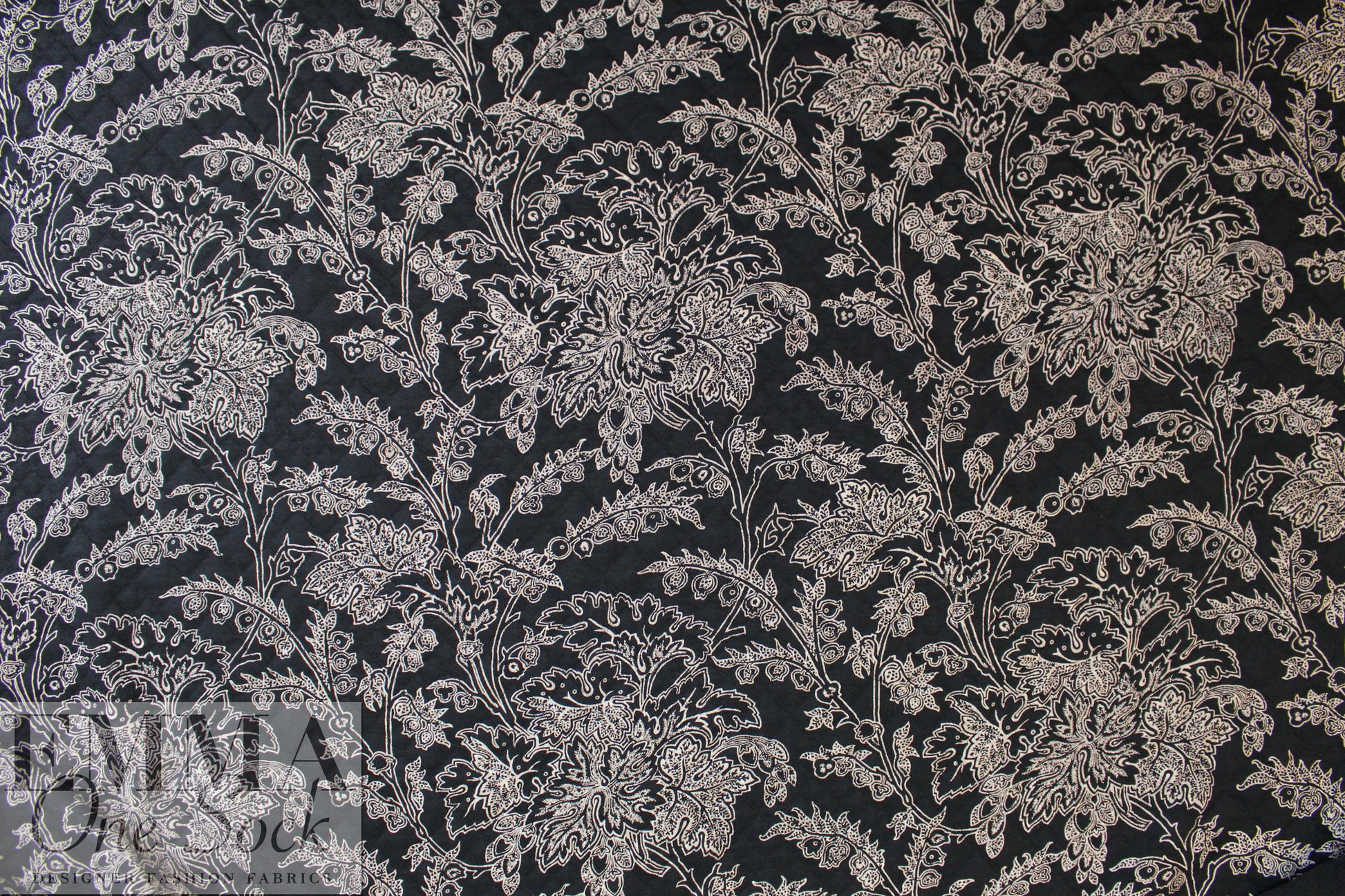 French printed 3-ply quilted-look knit - black deco flor 1 yard