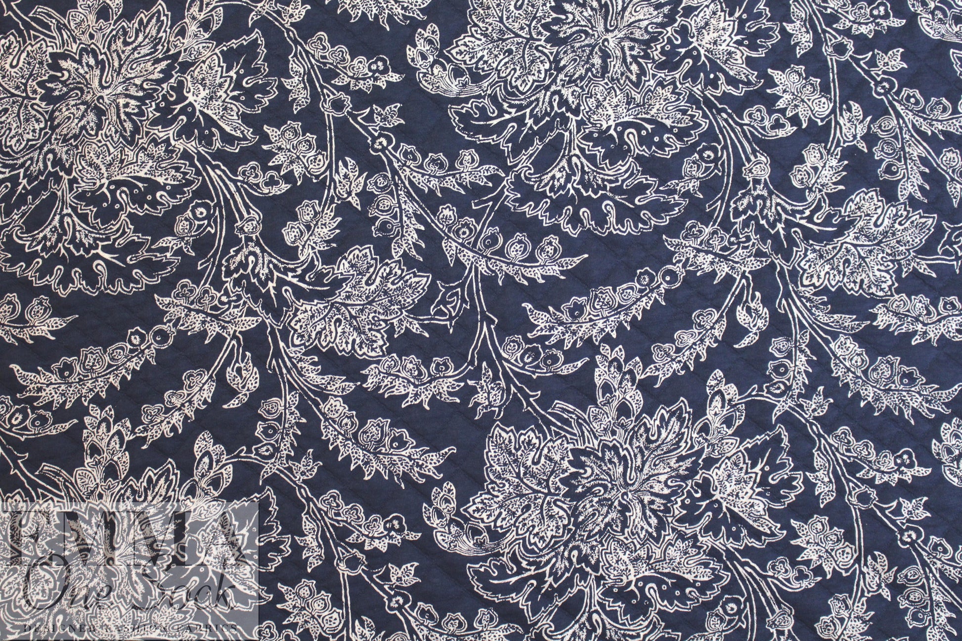 French printed 3-ply quilted-look knit - navy deco flor 2.6 yds