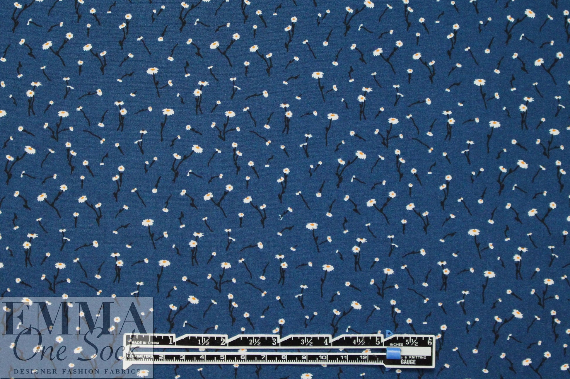 teeny blossoms on marine blue drapey rayon woven