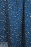 teeny blossoms on marine blue drapey rayon woven