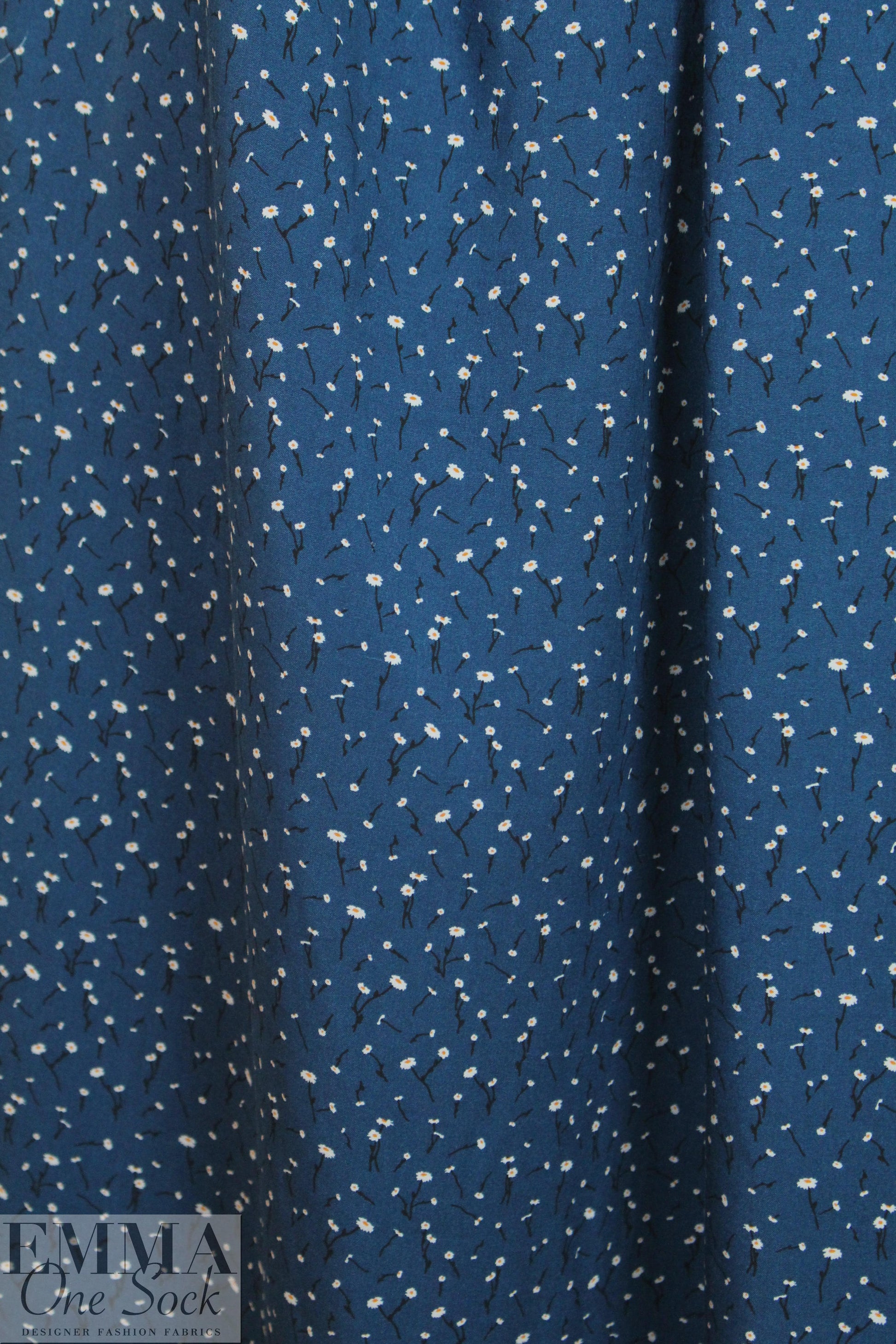 teeny blossoms on marine blue drapey rayon woven