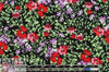 CA designer blossoms on black drapey rayon woven