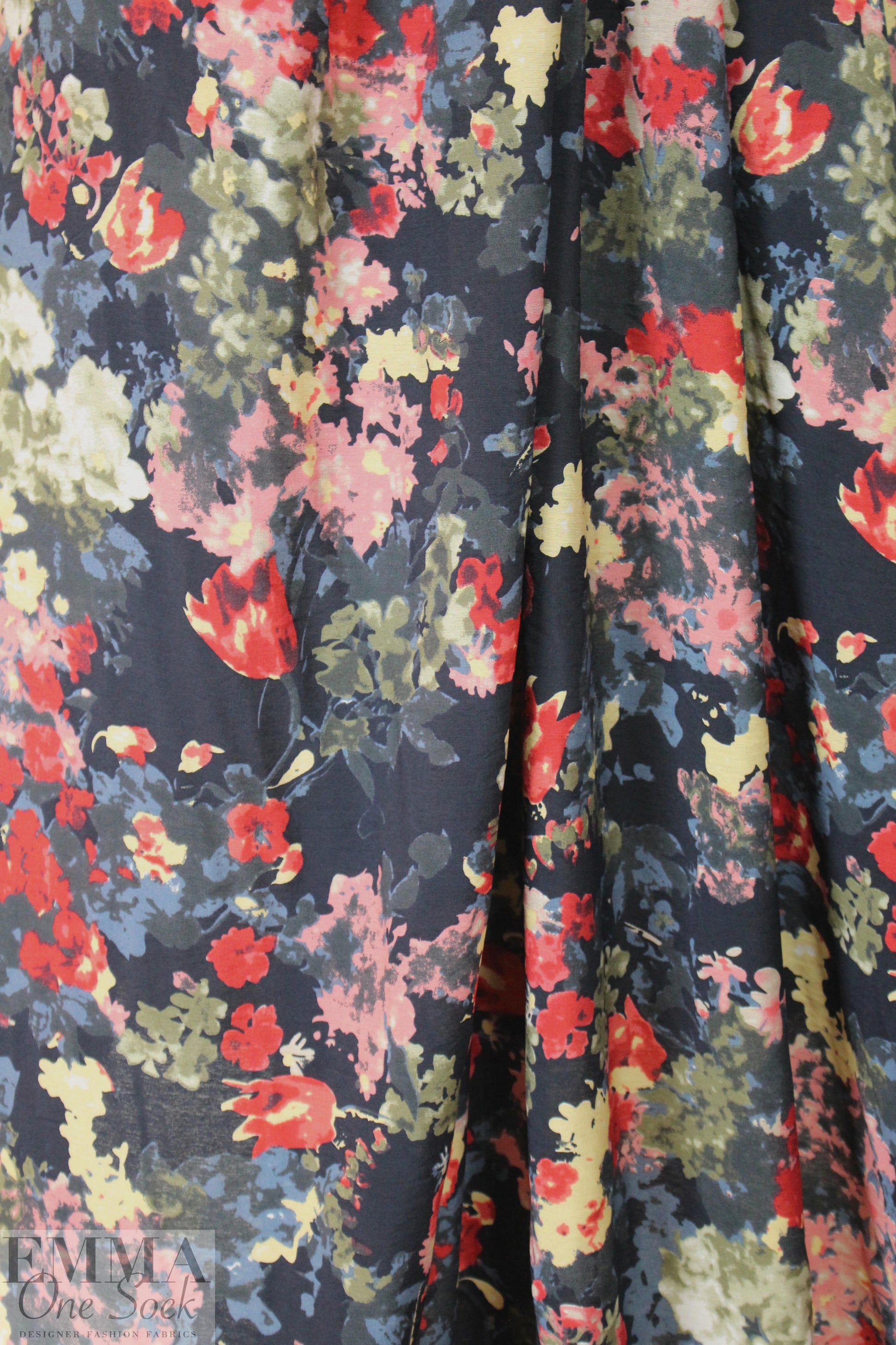 viscose/nylon blossoms on black drapey woven