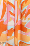 'layered leaves' rayon challis woven - pumpkin/light pink 1.875 yd