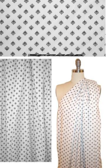 black motif on soft white drapey viscose woven
