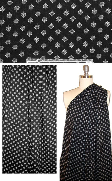 white motif on black drapey viscose woven .75 yds