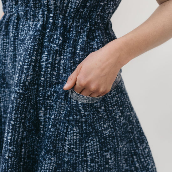 close up of hand in pocket of the women's Ghanaian Smock.