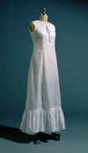 white princess slip on  a dress form.