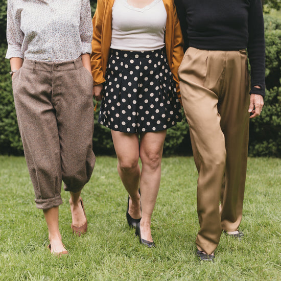 three women walking surrounded by greenery one wearing the trousers, shorts and pants from 250 Hollywood Pants