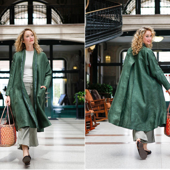 Front and back view of white blonde woman walking holding a woven bag wearing the 254 Swing Coat