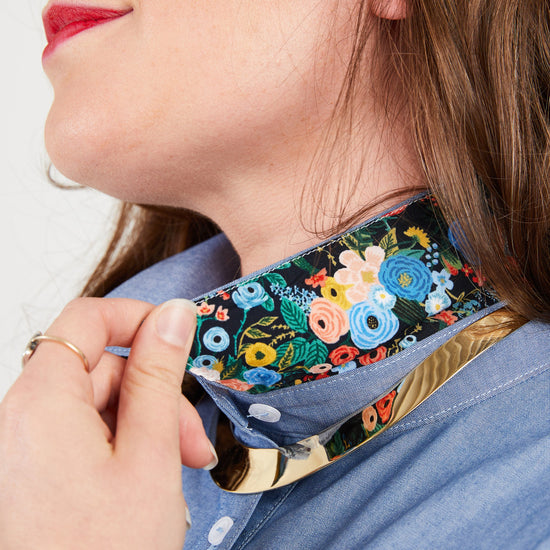 Person wearing a floral-patterned choker on a plain background. This button-up shirt is the Harrison Shirt sewing pattern from Cashmerette.