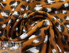 golden brown leopard dot poly crepe woven 1.75 yd