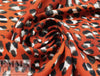 paprika leopard dot poly crepe woven 1.625 yd