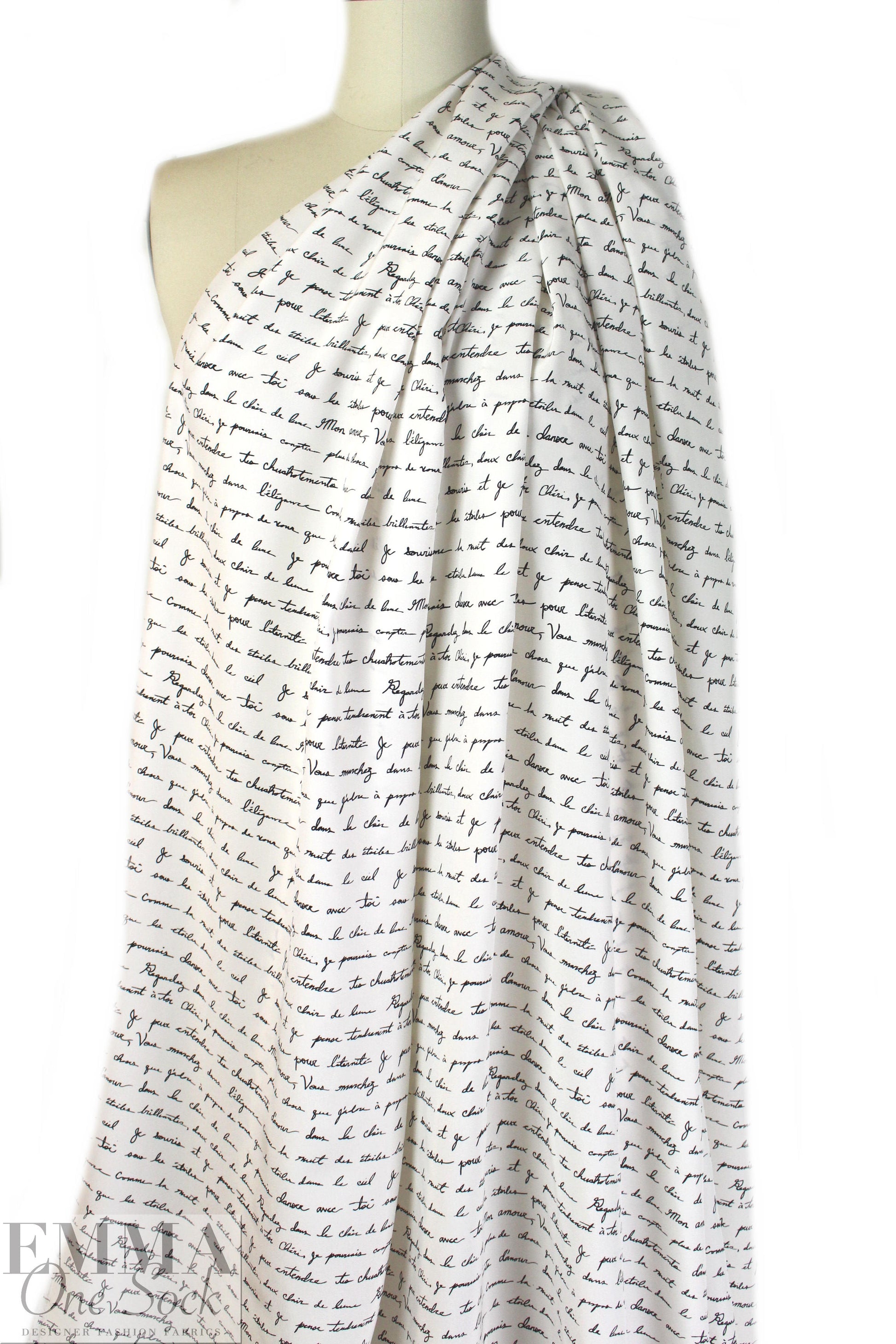 Italian black on cream french script silk charmeuse .95 yds